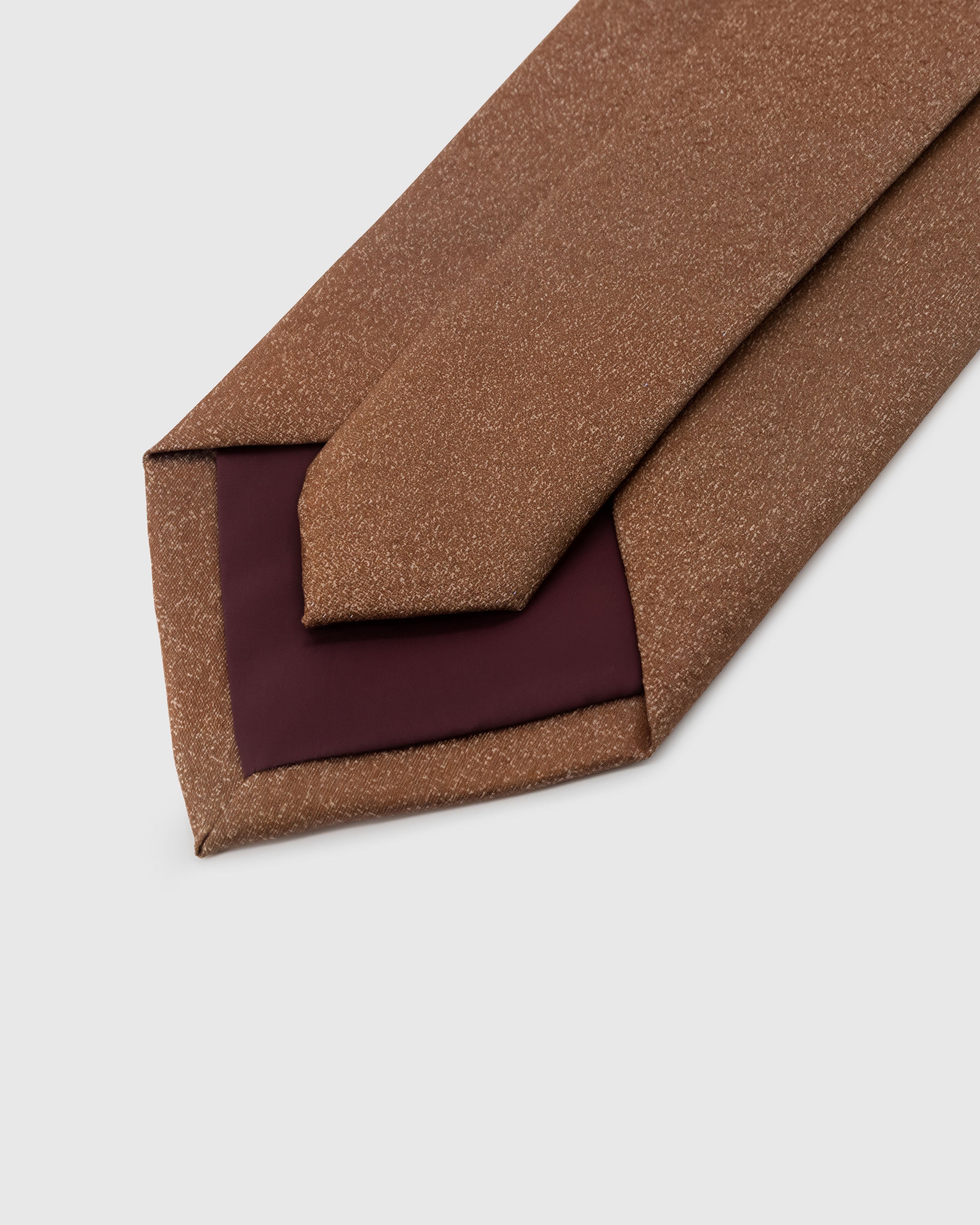 STICKYZOO Caramel Shantung Tie back detail showing structured interlining and hand-finished slip stitching, 145 × 8 cm