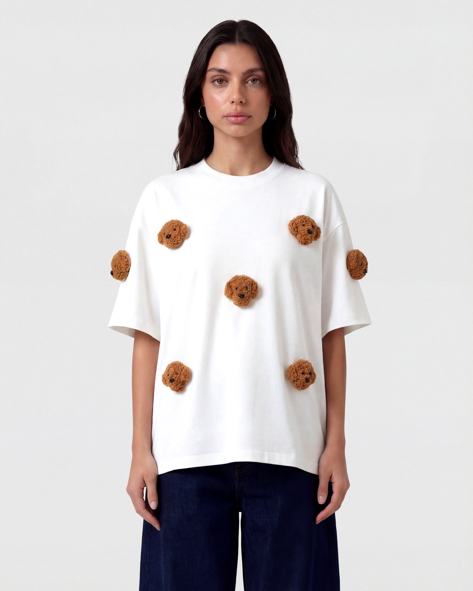 {{Rated 4.9 by thousands}} Model in white Poodle Parade T-Shirt front view showing all seven plush poodle appliques