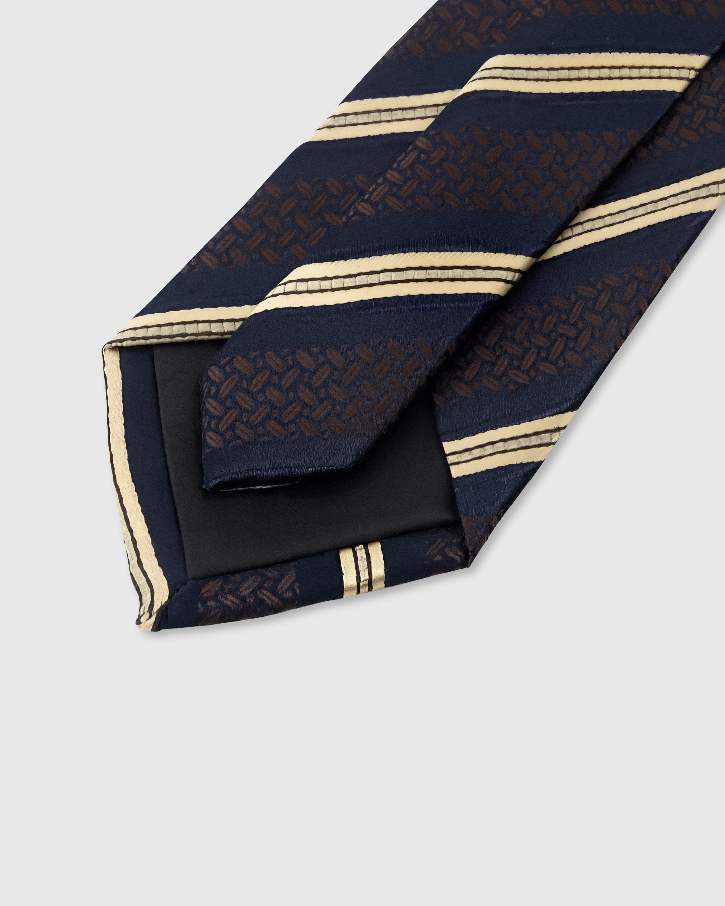 STICKYZOO Navy Brocade Stripe Tie back detail showing structured interlining and hand-finished slip stitching, 145 × 8 cm