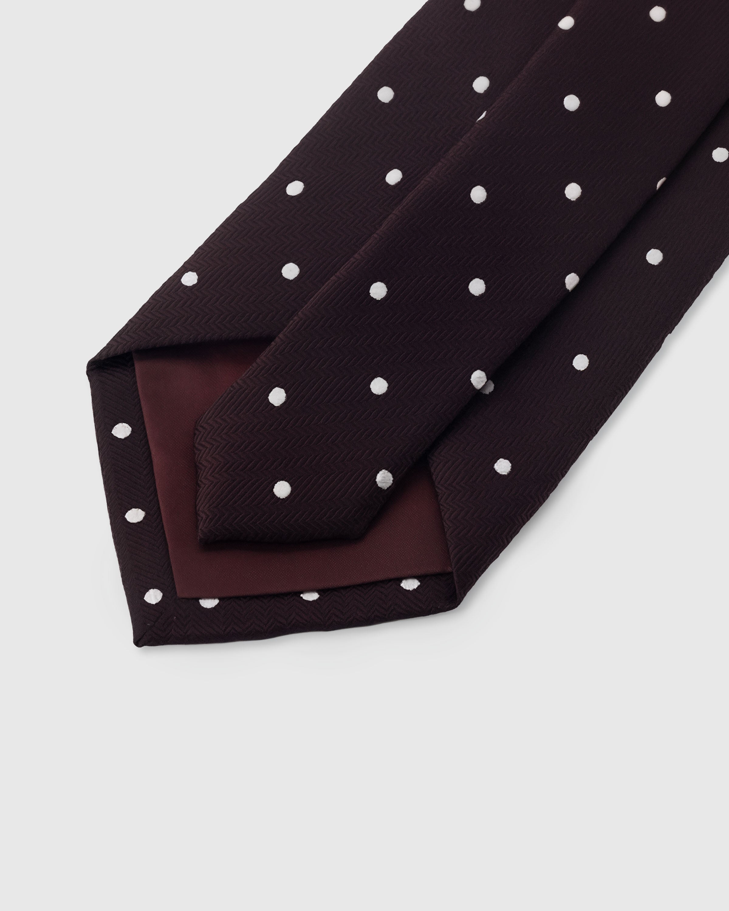 {Hand-finished interior} STICKYZOO ESPRESSO POLKA TIE back detail showing structured interlining and hand-finished slip stitching, 145 x 8 cm