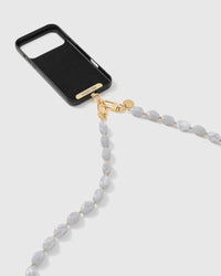 Cloud marble link phone strap attached to black phone case showing cross-body carry