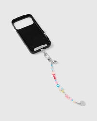 Full phone with colorful charm bead strap attached on light background