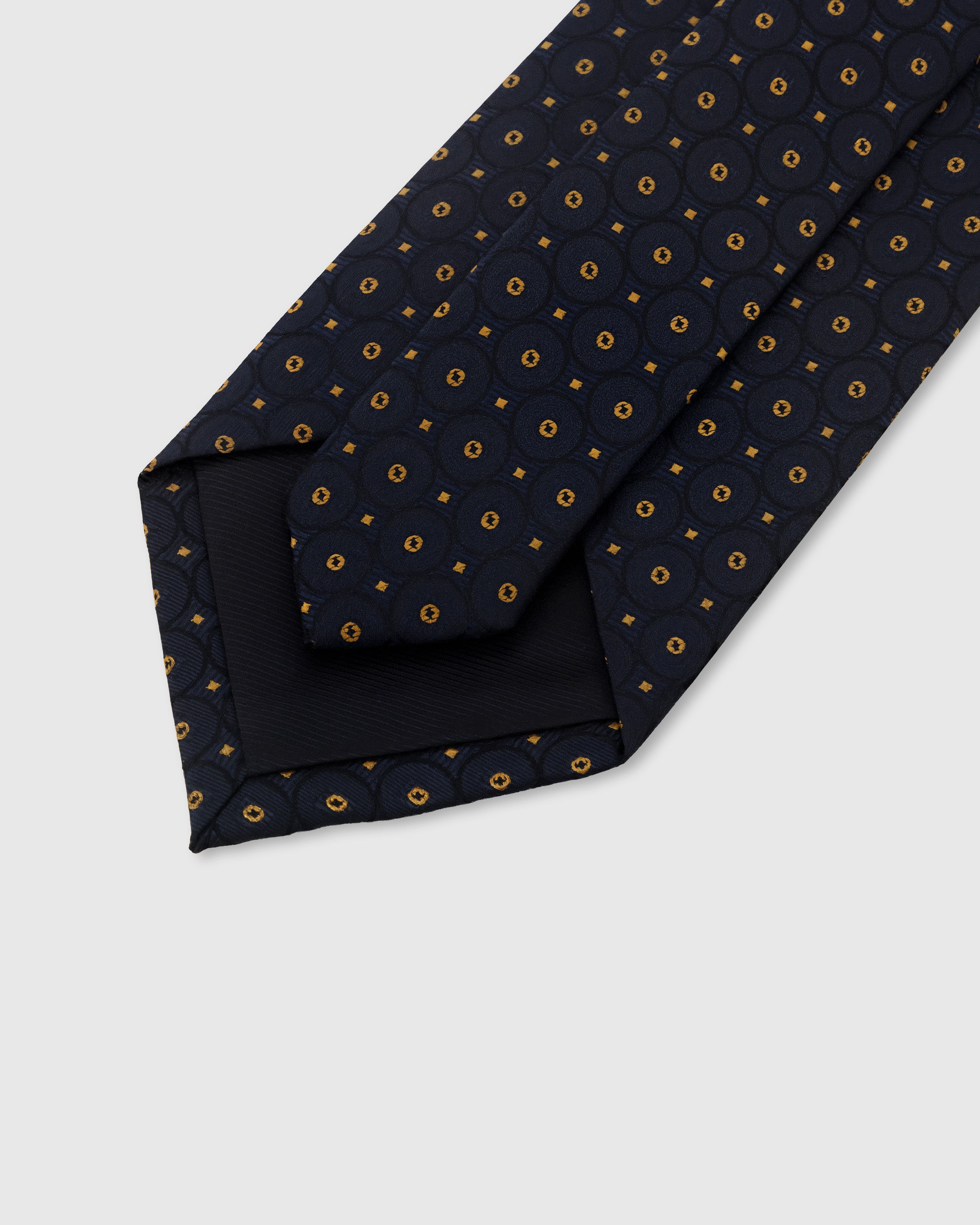 STICKYZOO Midnight Medallion Tie showing structured interlining and dimensional knot, 145 x 8 cm