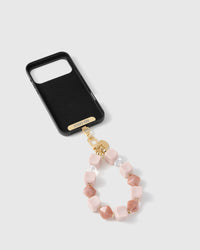 Inside of phone case showing STICKYZOO Phone Strap Card with rose marble strap attached