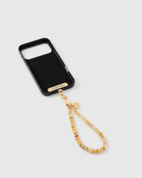 Inside of phone case showing STICKYZOO Phone Strap Card with saffron stone strap attached