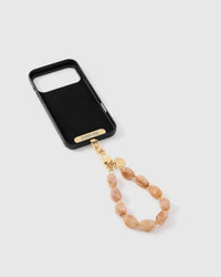 Inside of phone case showing STICKYZOO Phone Strap Card with blush marble strap attached