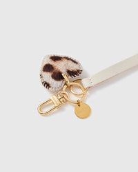 Close-up of the snow-leopard calf-hair heart, hand whip-stitched edge and hand-cut ivory leather by STICKYZOO