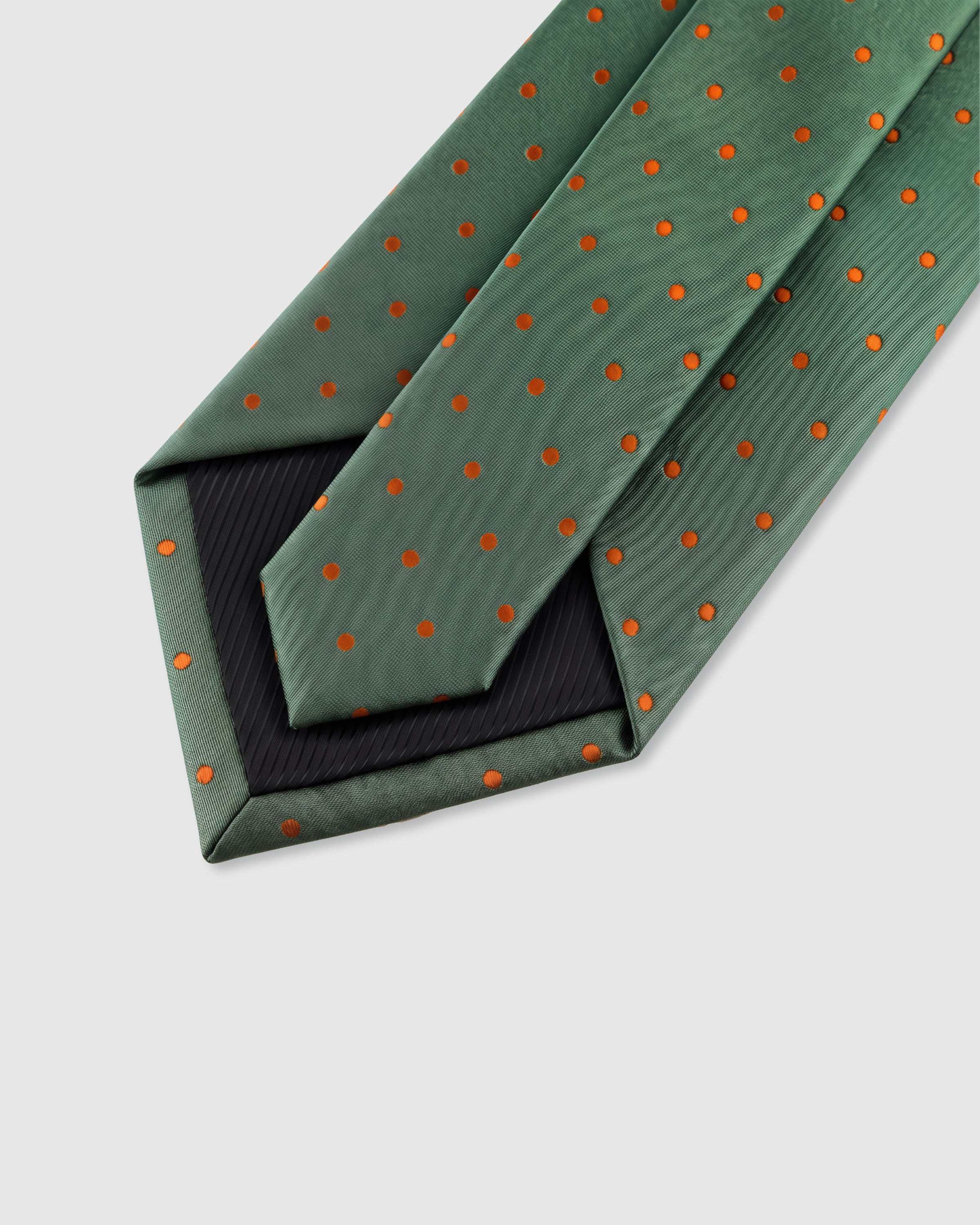{Hand-finished interior} STICKYZOO SAGE TANGERINE DOT TIE back detail showing structured interlining and hand-finished slip stitching, 145 x 8 cm