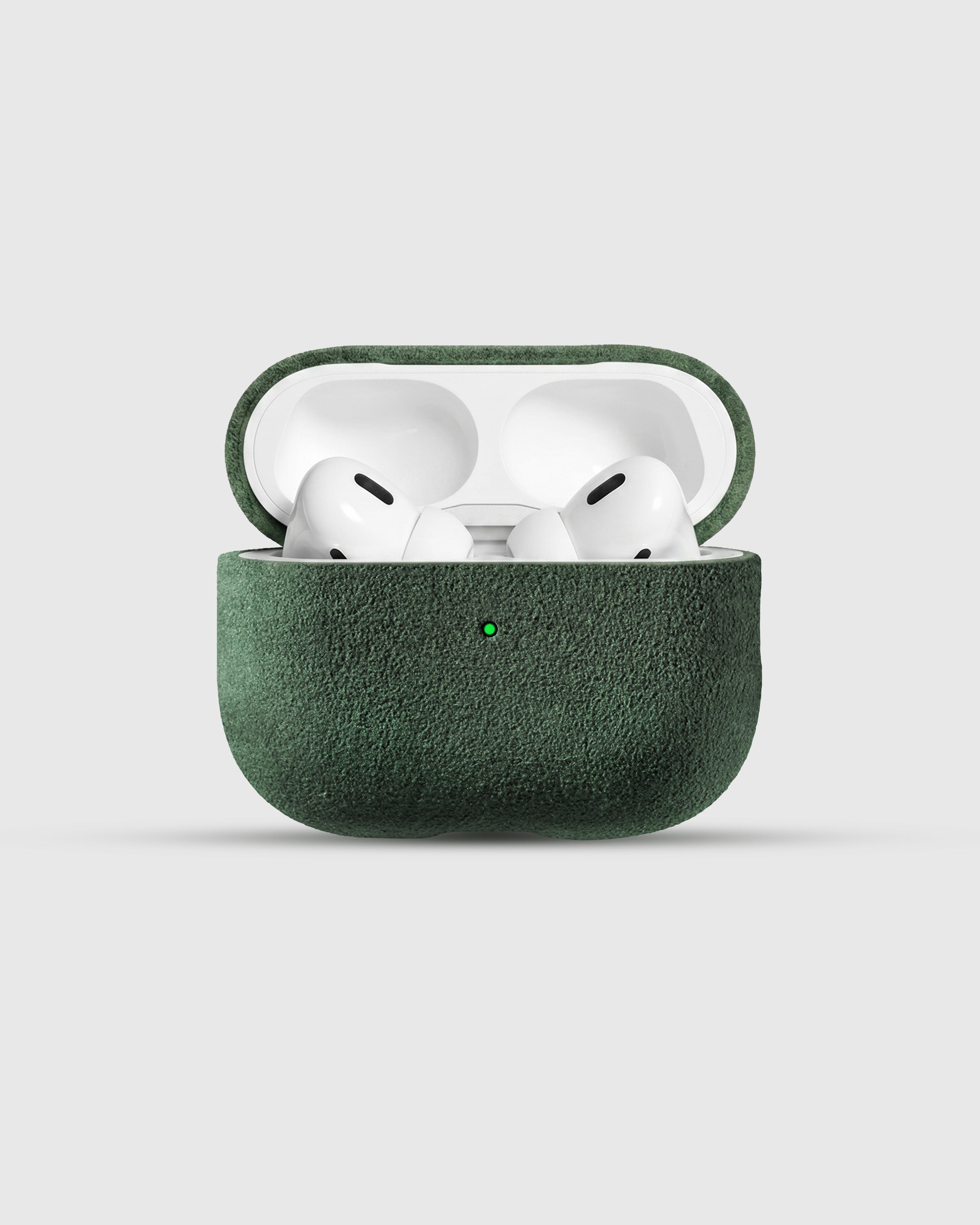 {{AirPods Pro fit securely.}} Evergreen Alcantara case open with AirPods Pro seated inside