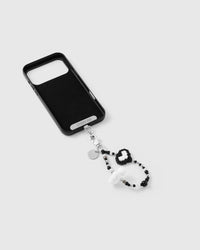 Inside of phone case showing STICKYZOO Phone Strap Card with noir heart cloud strap connected
