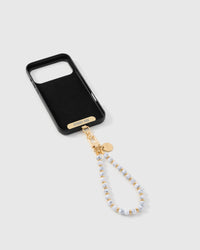 Close-up of gold-plated clasp and engraved STICKYZOO charm disc with marble beads