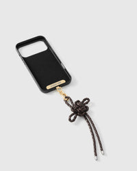 Inside of phone case showing STICKYZOO Phone Strap Card with mocha bow strap connected
