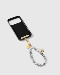 STICKYZOO Phone Strap Card universal adapter shown with the storm eye amulet strap