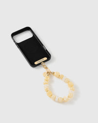 Buttermilk bead strap attached to a phone case with the included Phone Strap Card