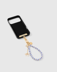 Inside of phone case showing STICKYZOO Phone Strap Card with porcelain bloom strap attached