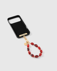 Inside of phone case showing STICKYZOO Phone Strap Card with ruby agate strap attached