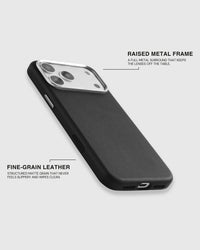 Fine-grain leather grain and the full raised metal camera surround on the black iPhone case