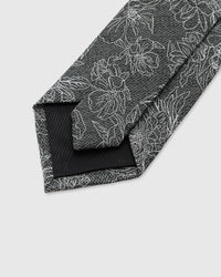 STICKYZOO Slate Botanical Tie interior showing hand-finished slip stitching and structured interlining, 145 × 8 cm