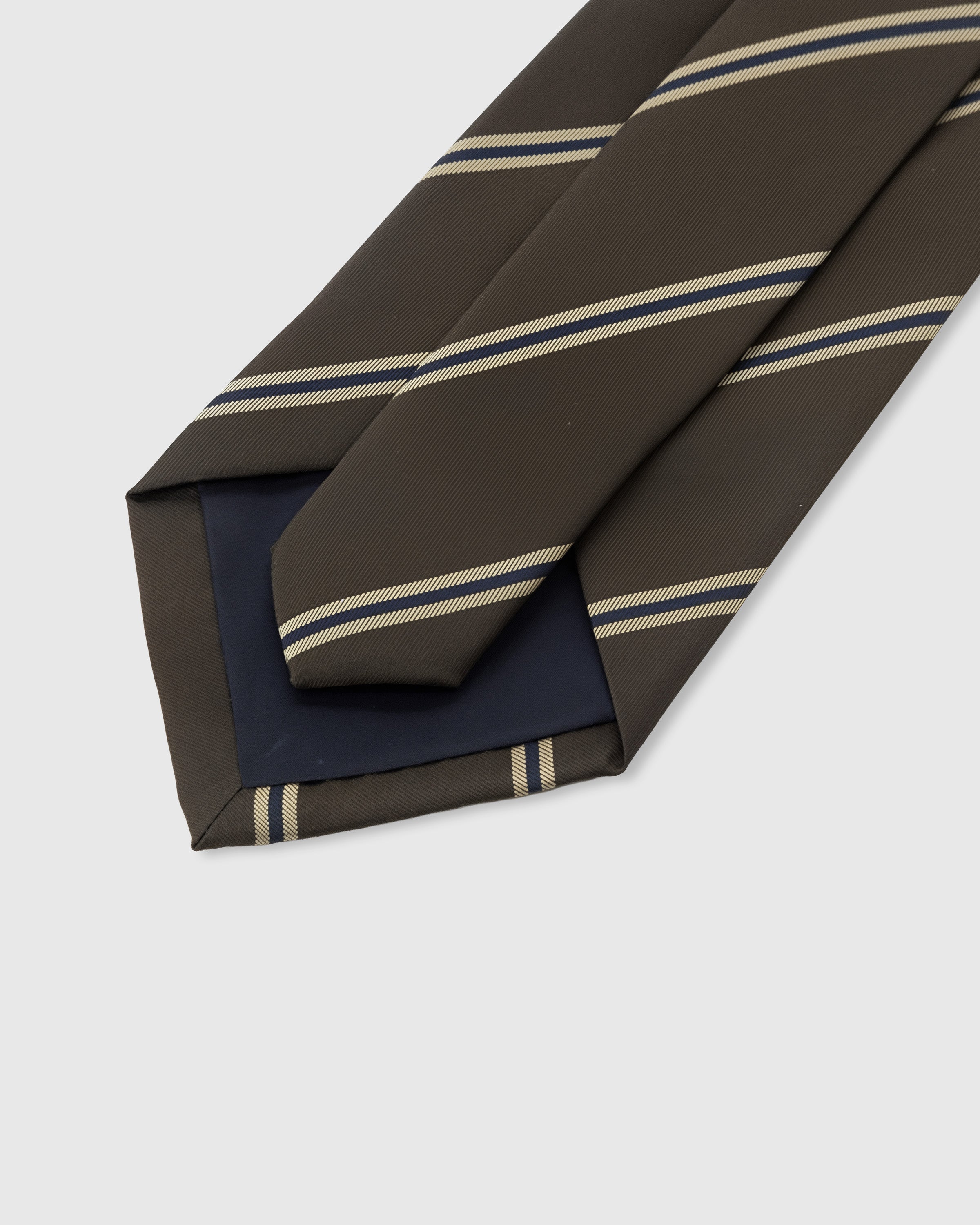 {{Structured interlining}} STICKYZOO Espresso Triple Stripe Tie showing structured interlining and dimensional knot, 145 x 8 cm