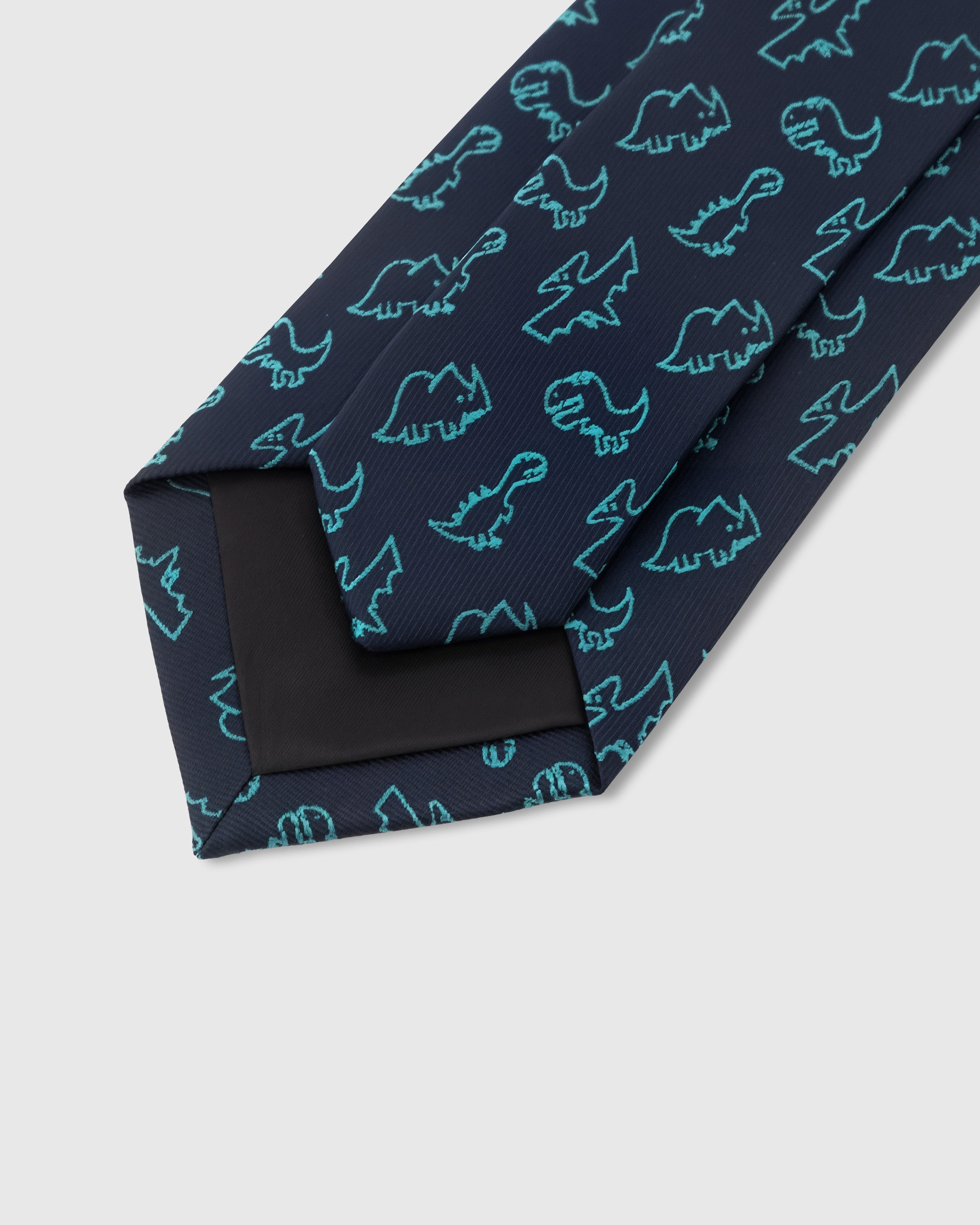 STICKYZOO Midnight Dino Tie interior detail showing structured interlining and hand-finished slip stitching, 145 × 8 cm