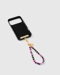 Inside of phone case showing STICKYZOO Phone Strap Card attachment with purple agate strap connected
