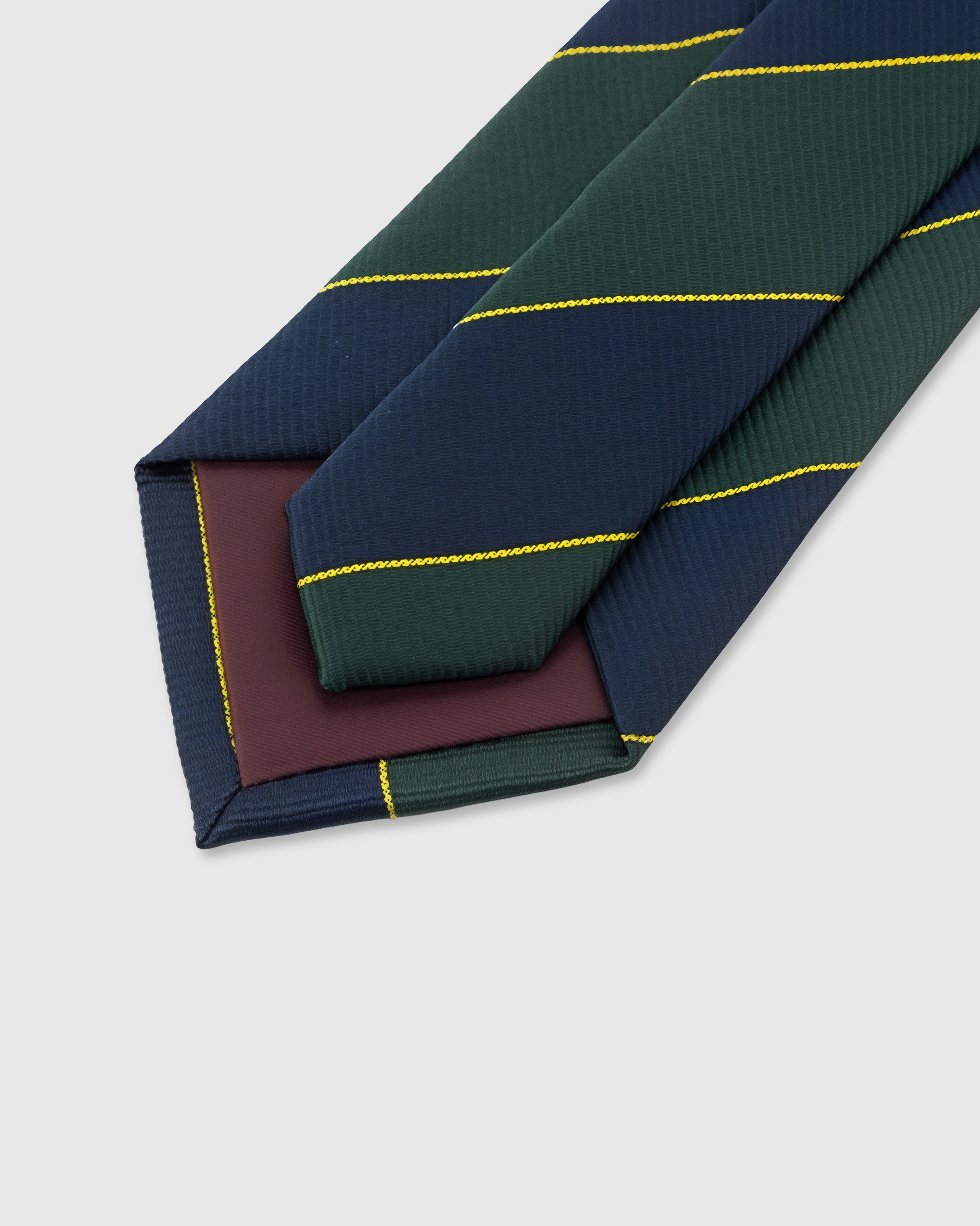 STICKYZOO Forest Block Stripe Tie construction detail showing structured interlining and hand-finished slip stitching, rated 4.9 stars