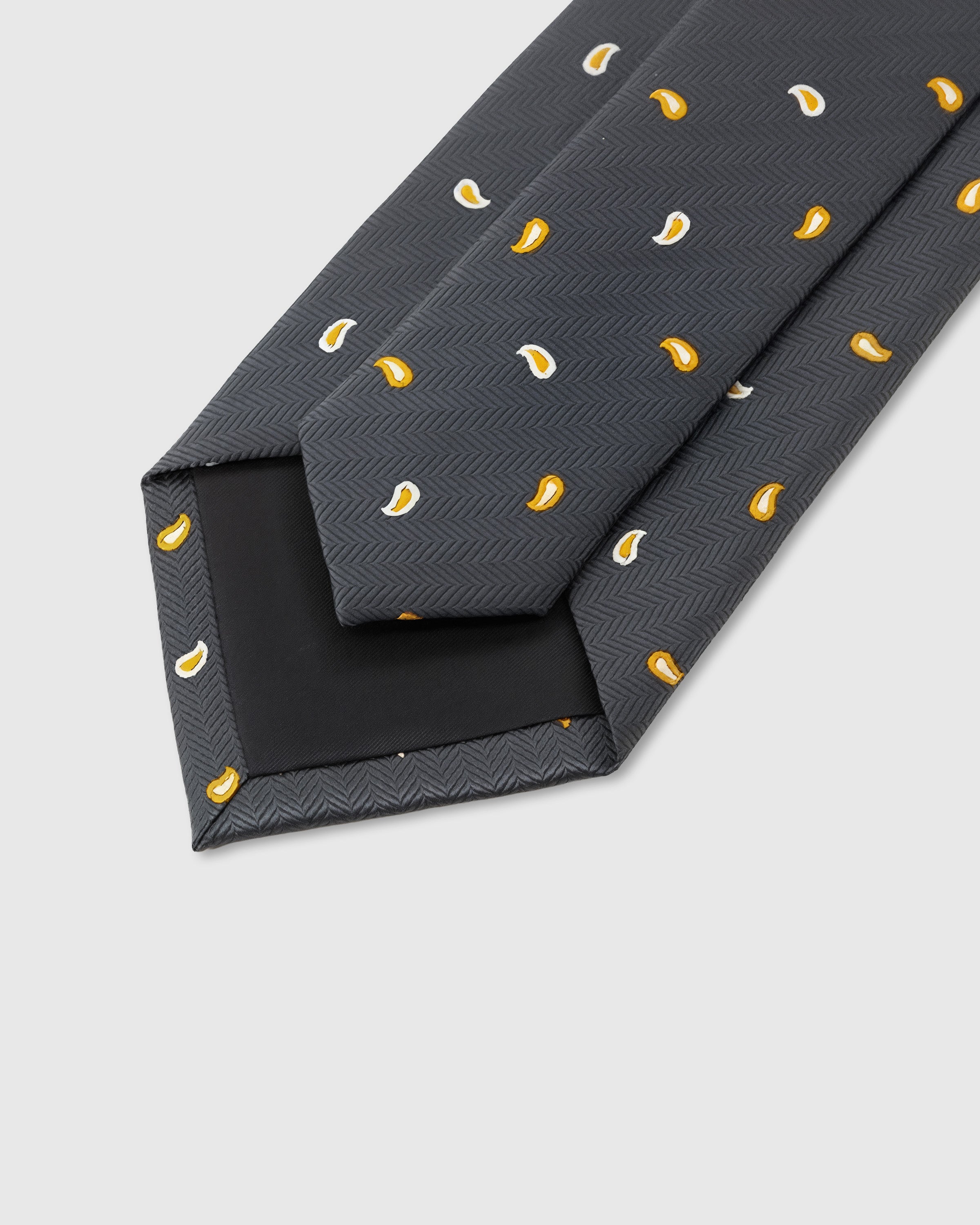STICKYZOO Slate Paisley Tie interior showing hand-finished slip stitching and structured interlining, 145 × 8 cm