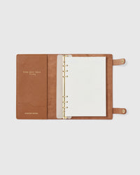 STICKYZOO camel genuine goatskin notebook open showing refillable A5 ring system, 100 GSM premium paper, swap inserts anytime
