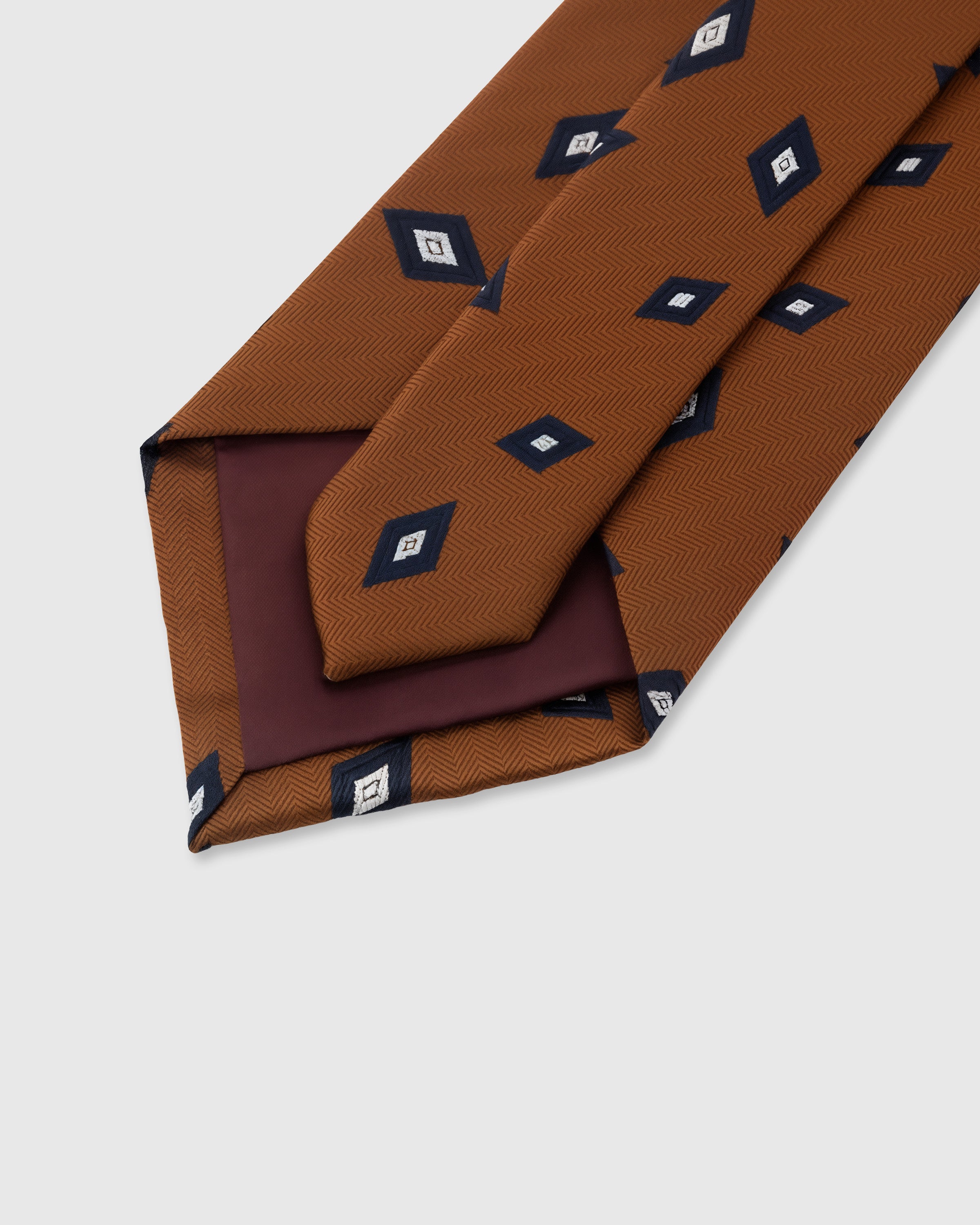 STICKYZOO Cognac Diamond Foulard Tie back detail showing structured interlining and hand-finished slip stitching, 145 x 8 cm