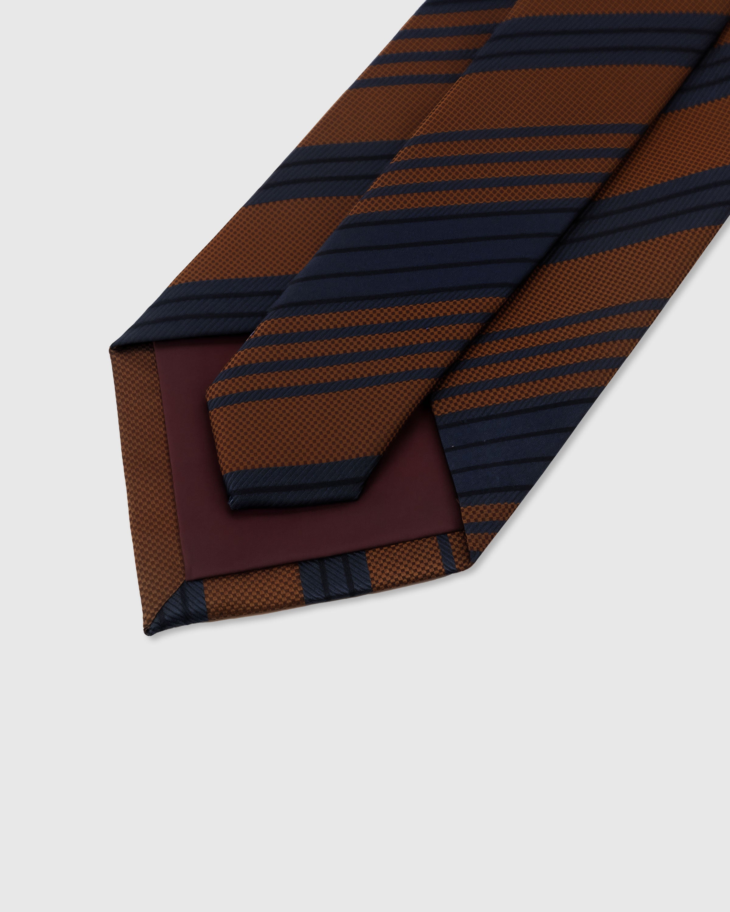 STICKYZOO Cognac Club Tie back detail showing structured interlining and hand-finished slip stitching, 145 x 8 cm