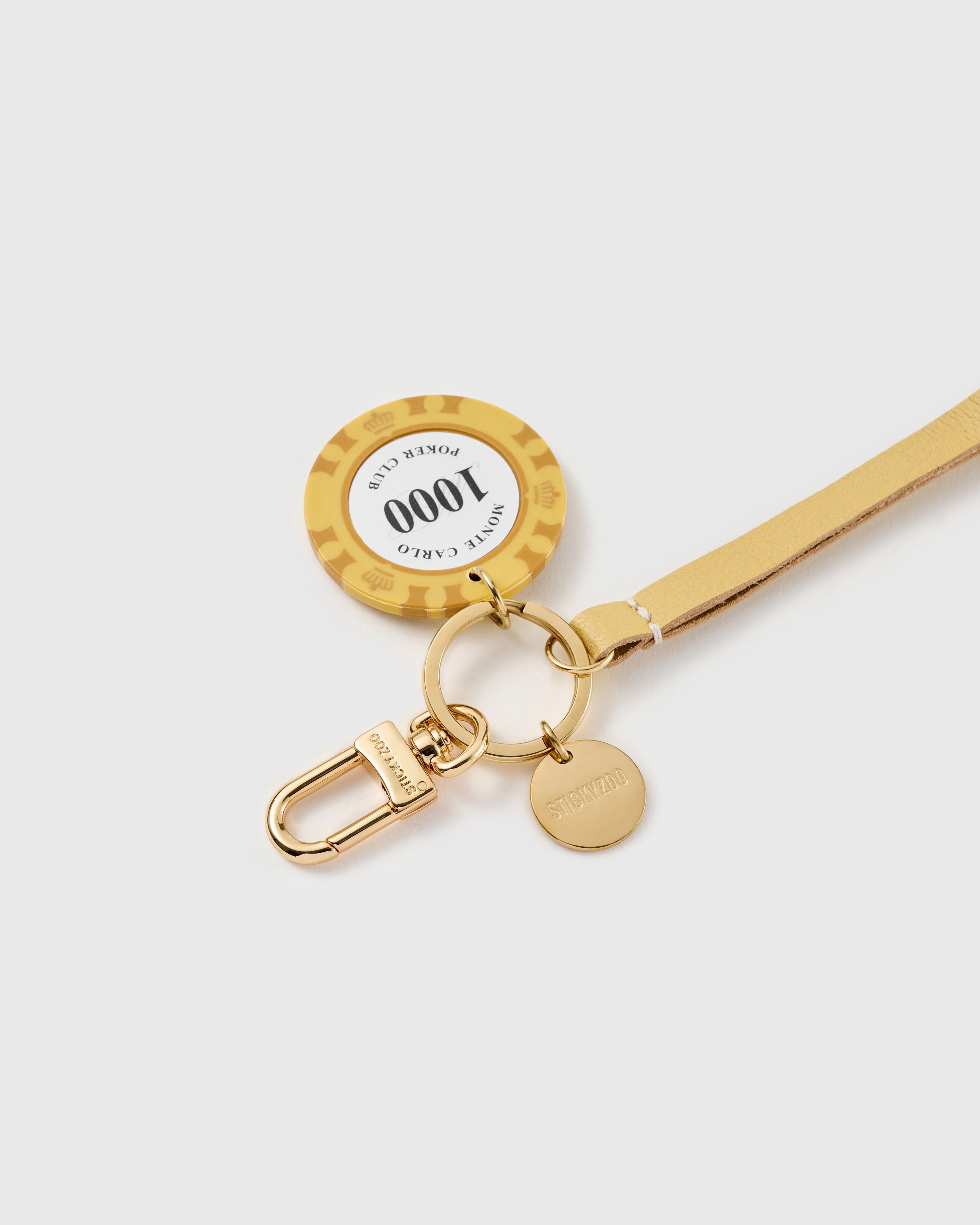 Lucky chip leather phone strap clipped to a phone case showing the hands-free wrist loop in use