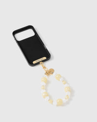 Inside of phone case showing STICKYZOO Phone Strap Card with butter crystal strap attached
