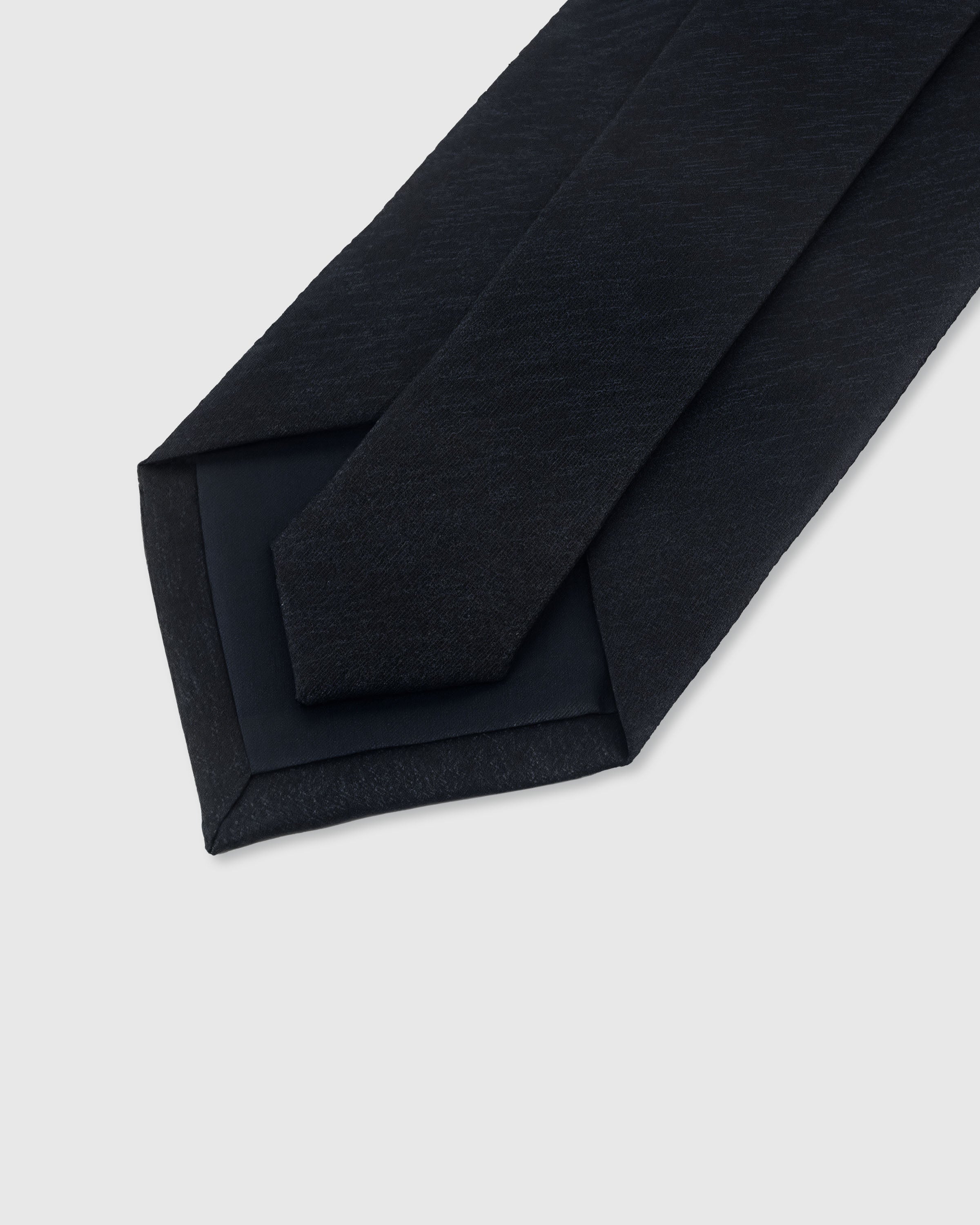 {Hand-finished interior} STICKYZOO MIDNIGHT SLUB TIE back detail showing structured interlining and hand-finished slip stitching, 145 x 8 cm