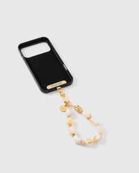 Inside of phone case showing STICKYZOO Phone Strap Card with gold hardware connection