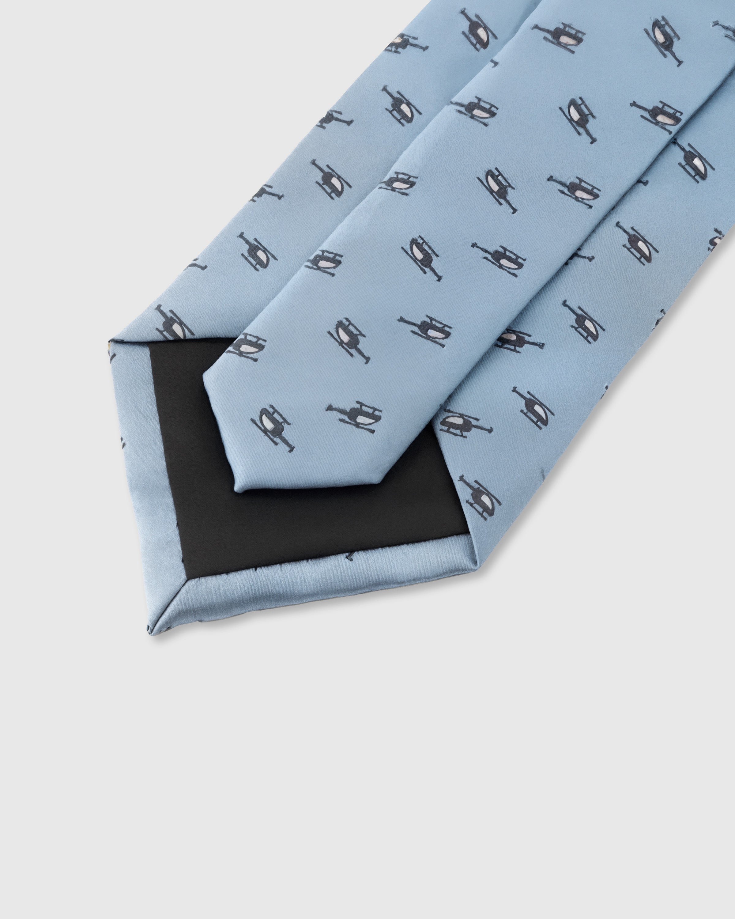 STICKYZOO Sky Helicopter Tie interior detail showing structured interlining and hand-finished slip stitching, 145 × 8 cm