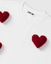 Alternate angle of white Scattered Heart T-Shirt on model showing relaxed boxy fit