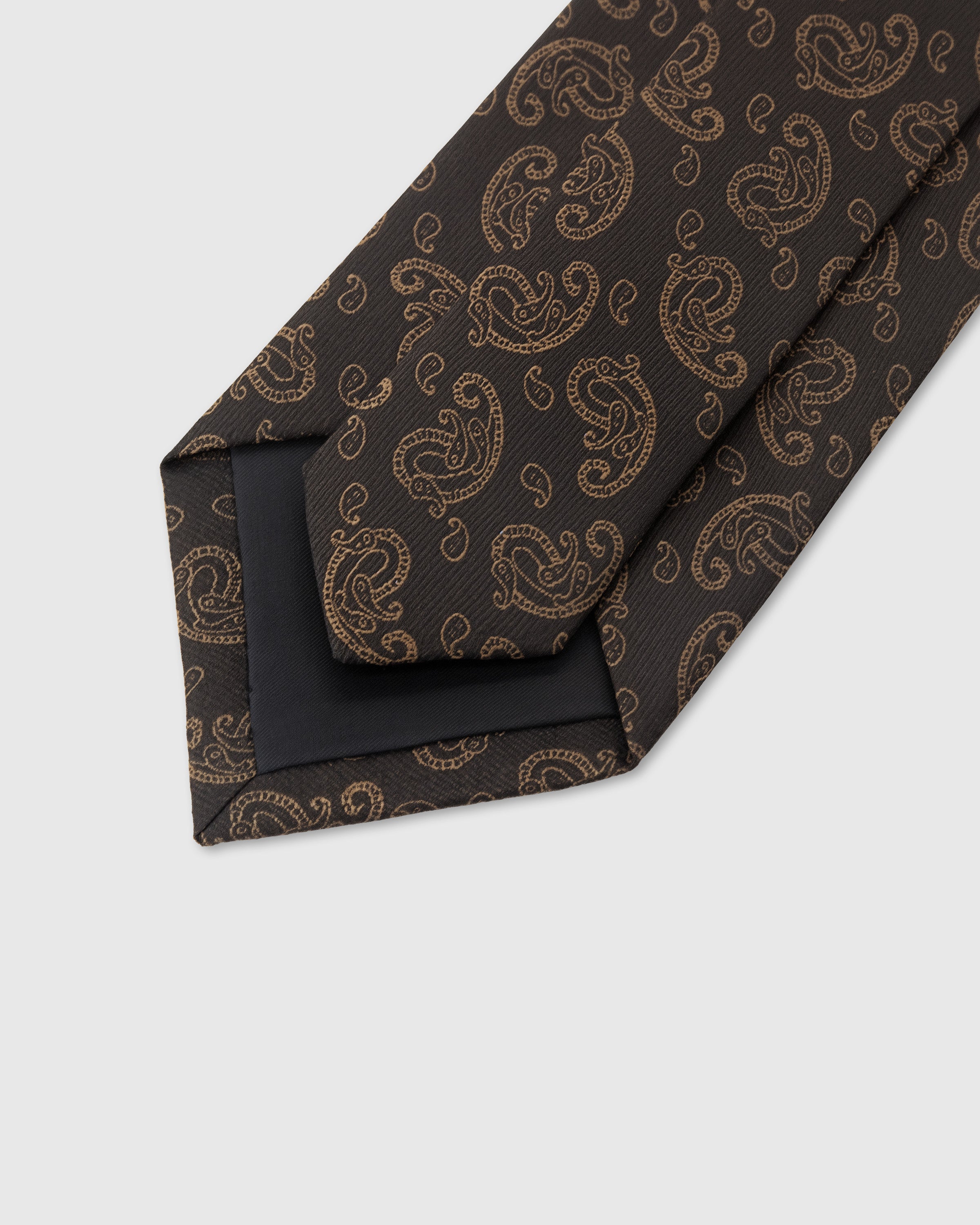 STICKYZOO Espresso Paisley Tie construction detail showing structured interlining and 45° bias-cut Italian method, rated 4.9 stars