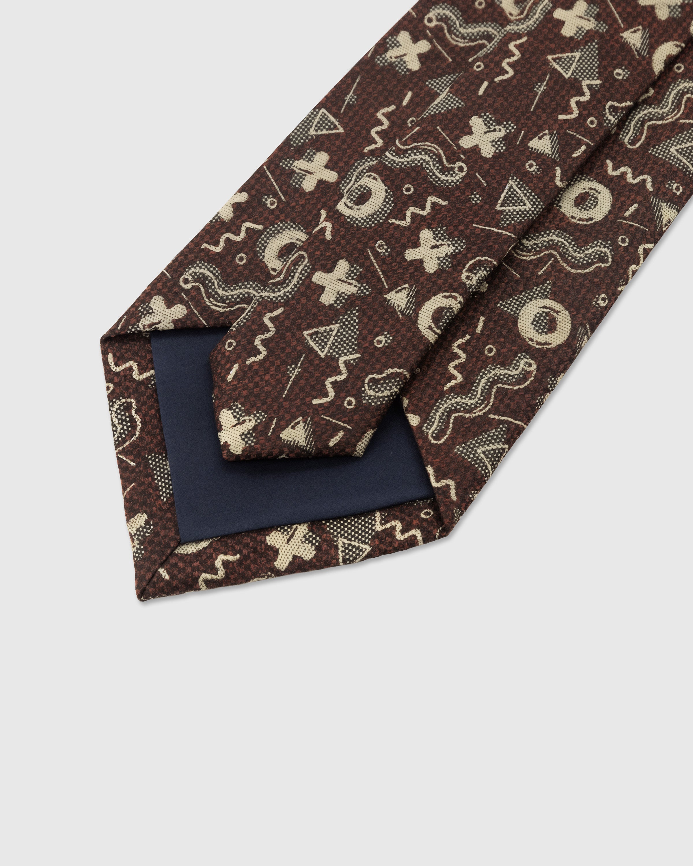 STICKYZOO Cocoa Abstract Motif Tie back detail showing structured interlining and hand-finished slip stitching, 145 x 8 cm