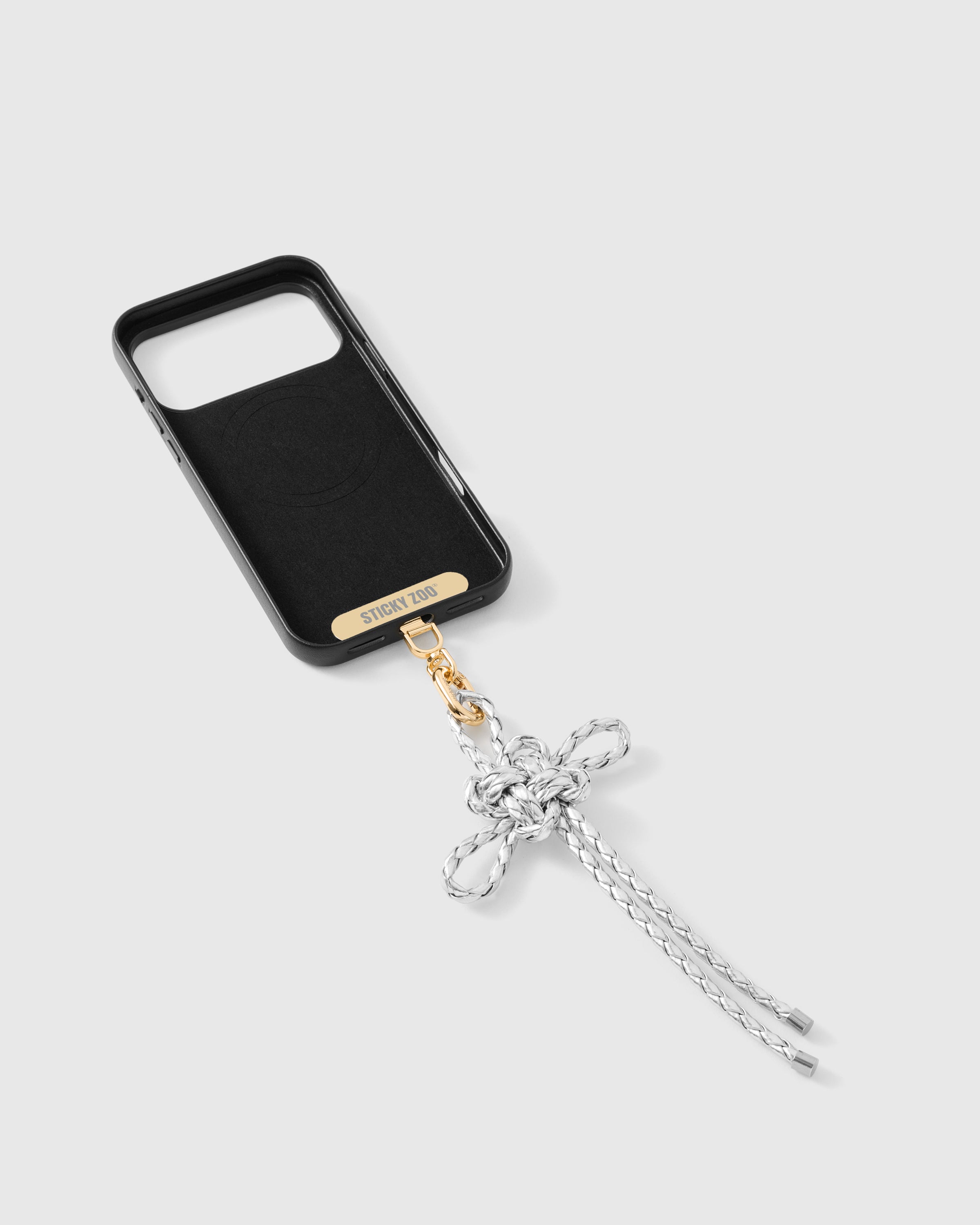 {{Strap Card included}} Inside of phone case showing STICKYZOO Phone Strap Card with pearl bow charm attached