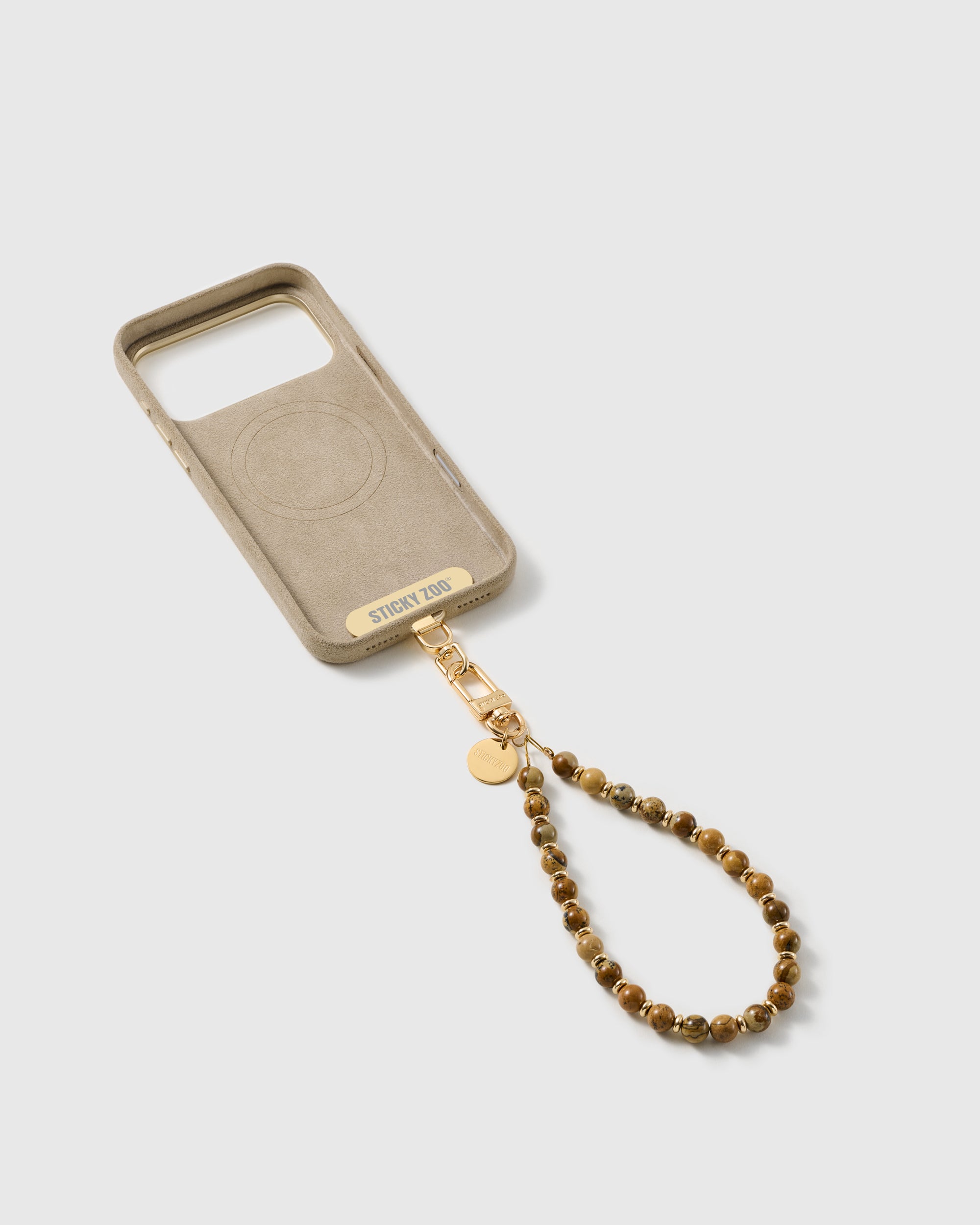 Inside of a phone case showing the included Phone Strap Card that lets the strap work with any case.