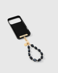 Full phone with obsidian marble stone strap attached on light background