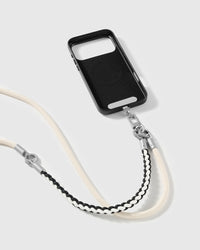 Ivory strap clipped to a black phone case for hands-free carry