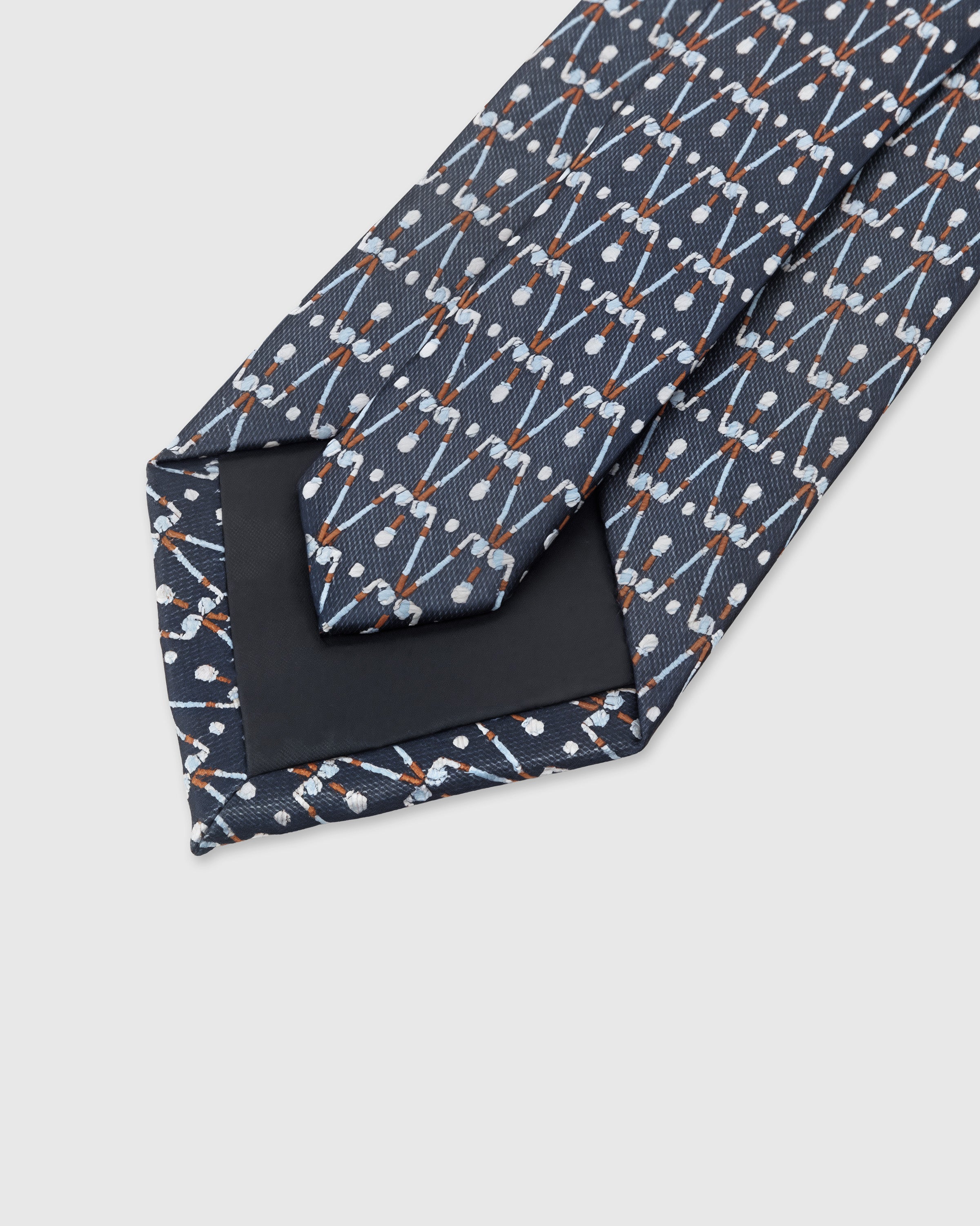 STICKYZOO Slate Geometric Tie showing structured interlining and dimensional knot, 145 x 8 cm