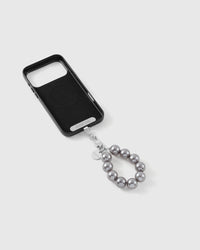 Grey pearl strap attached to a phone case with the included Phone Strap Card