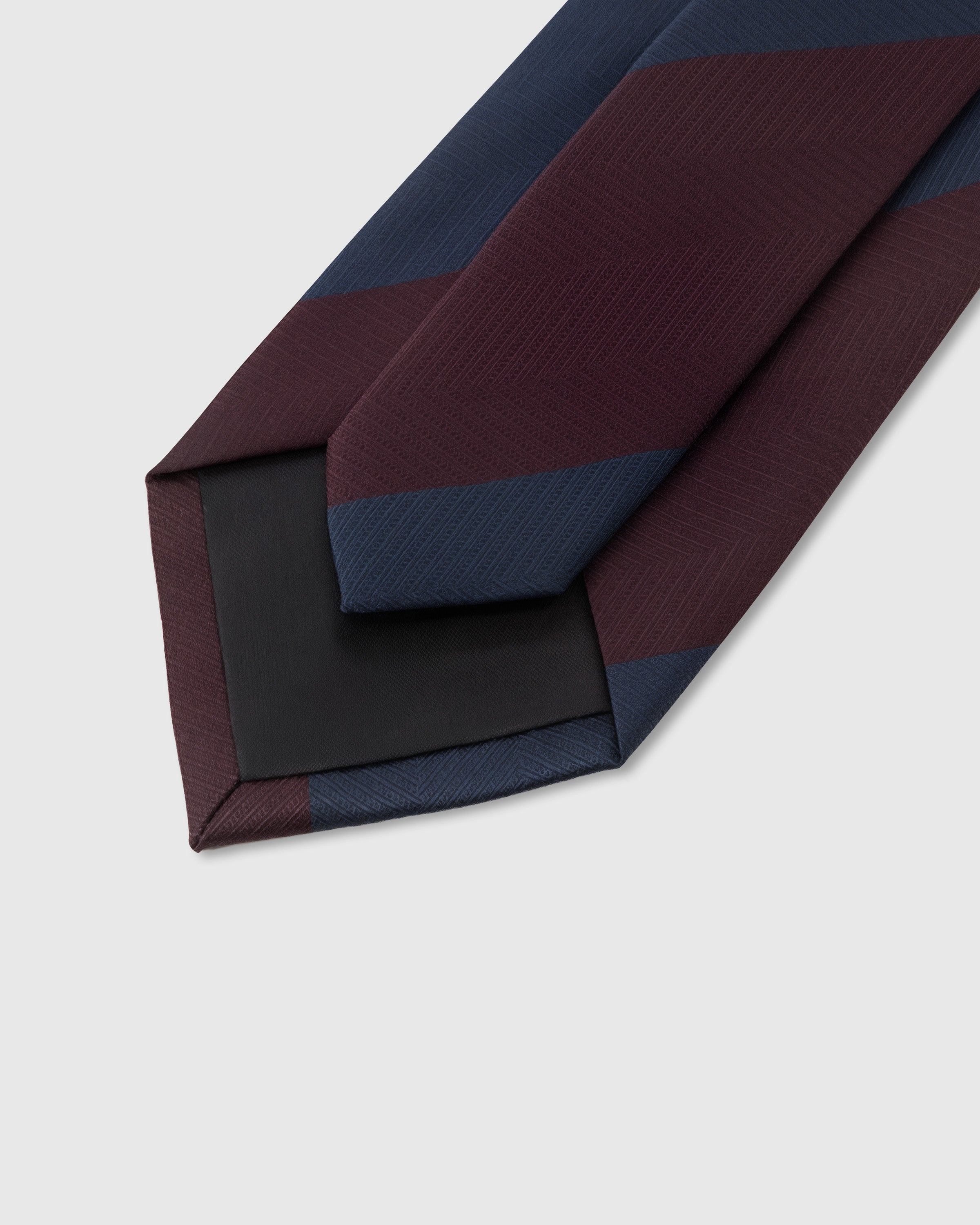 STICKYZOO Claret Block Stripe Tie back detail showing structured interlining and hand-finished slip stitching, 145 × 8 cm