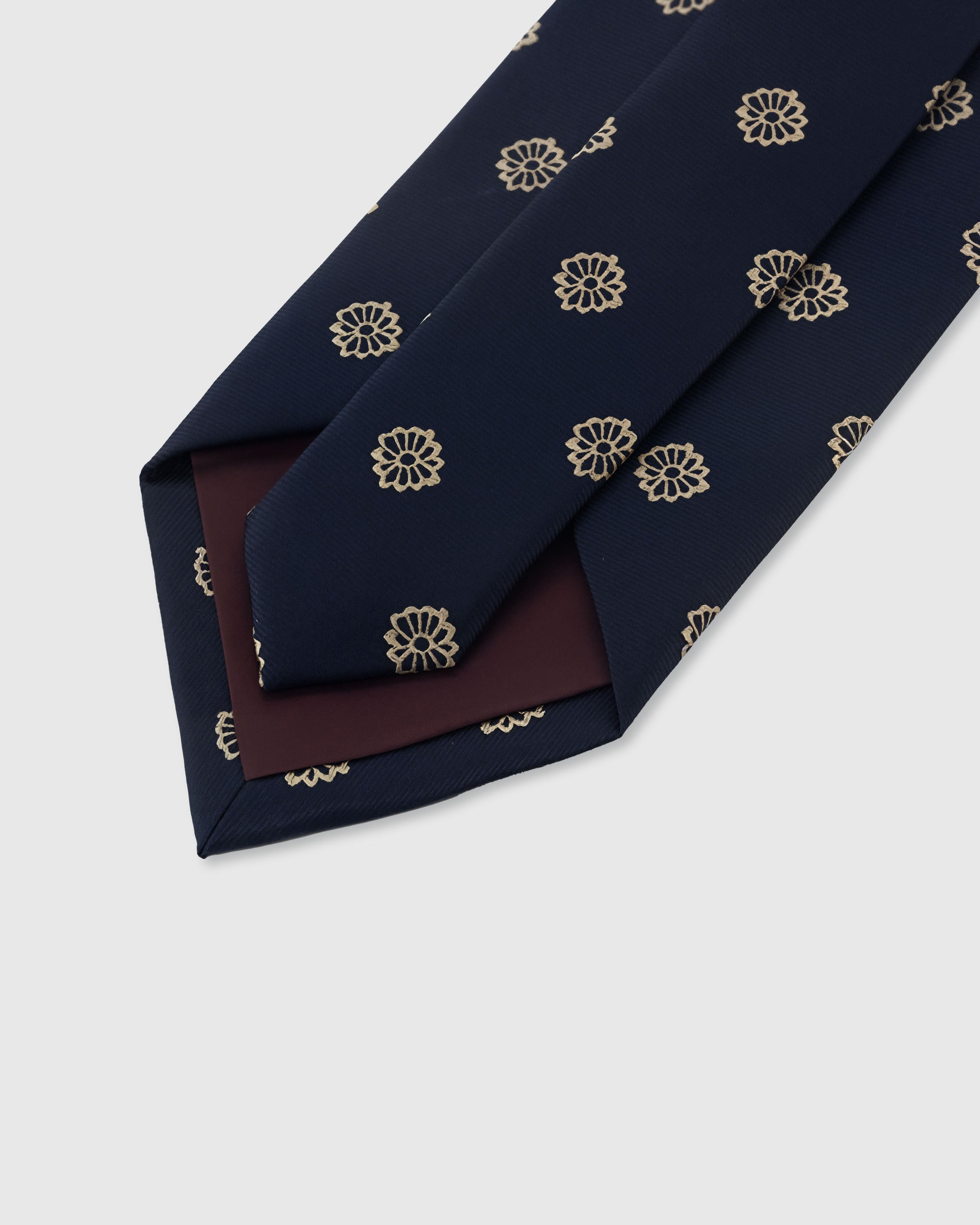 {Hand-finished interior} STICKYZOO MIDNIGHT ROSETTE TIE back detail showing structured interlining and hand-finished slip stitching, 145 x 8 cm