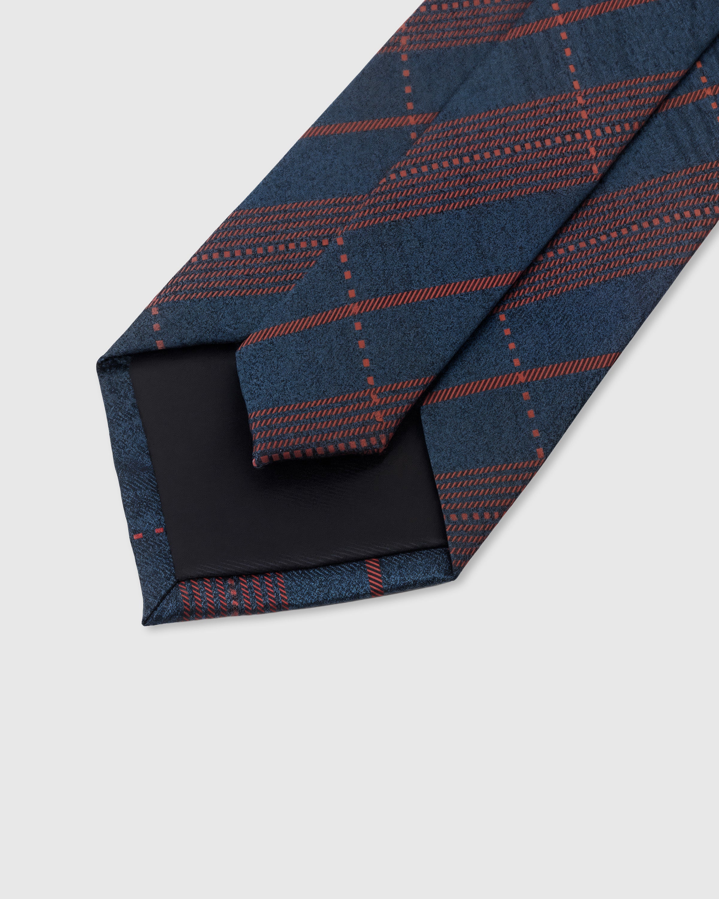 STICKYZOO Navy Tartan Tie interior detail showing structured interlining and hand-finished slip stitching, 145 × 8 cm