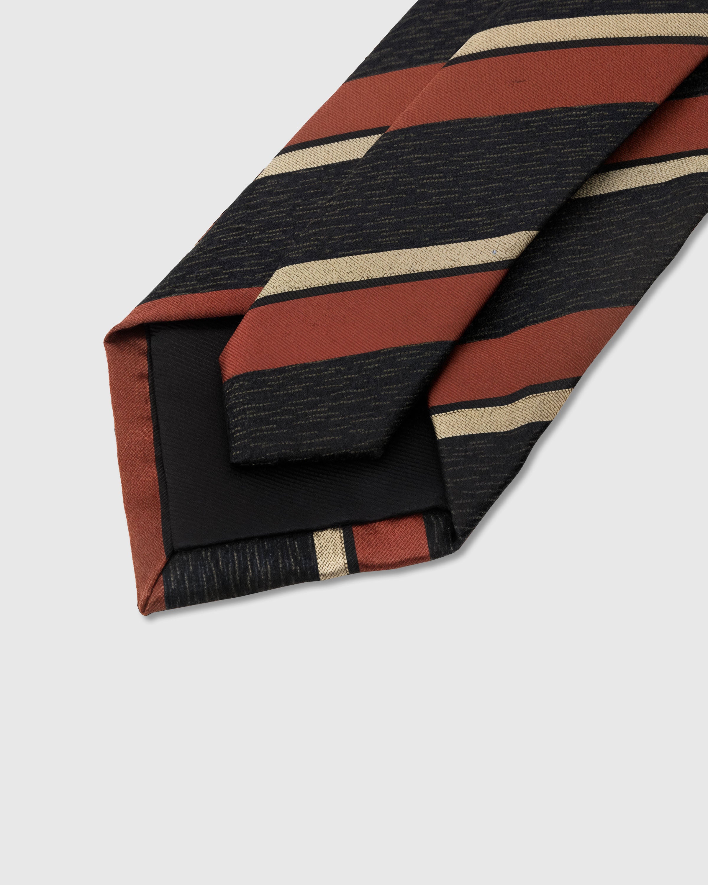 STICKYZOO Ember Regimental Tie back detail showing structured interlining and hand-finished slip stitching, 145 x 8 cm