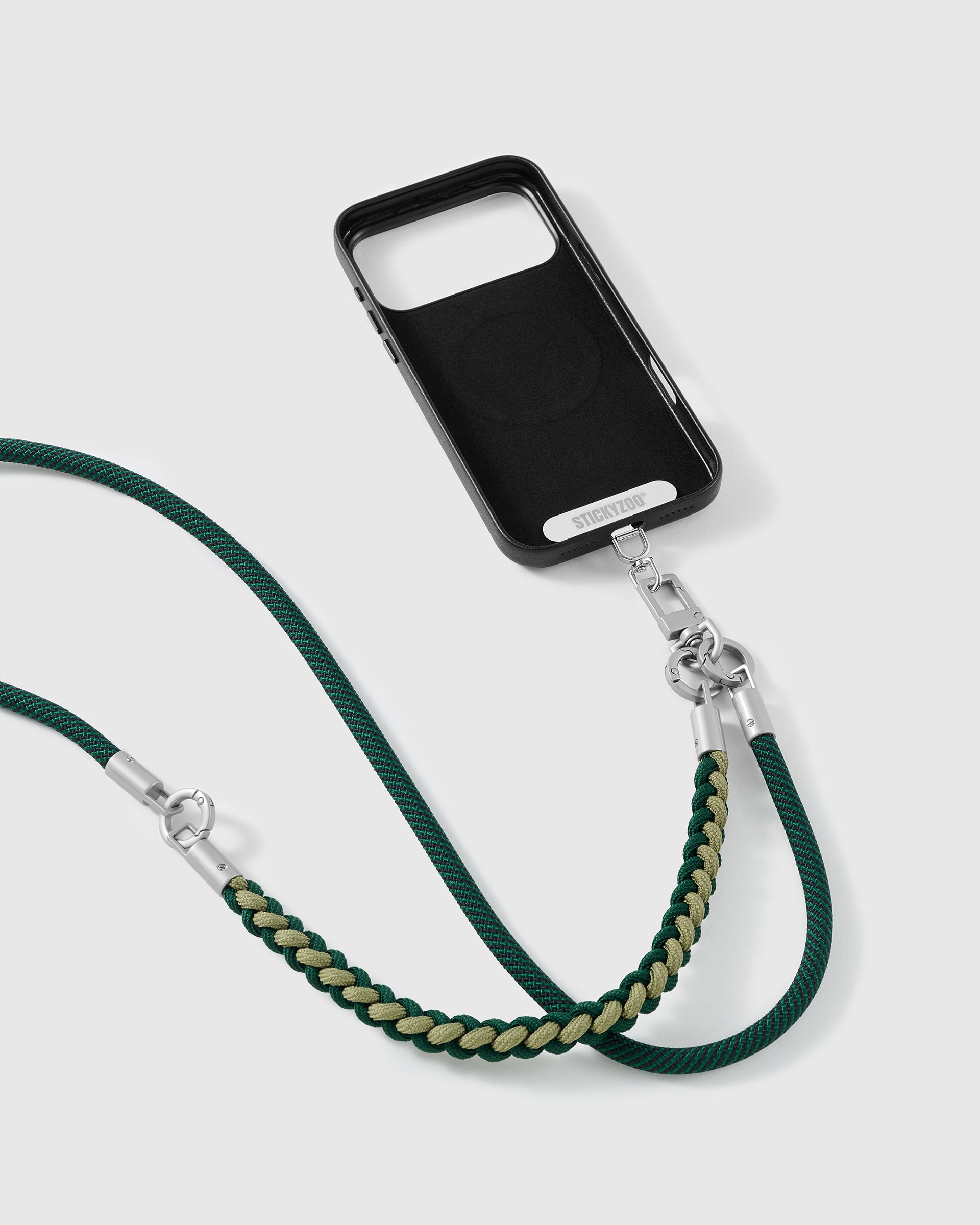 Pine strap clipped to a black phone case for hands-free carry