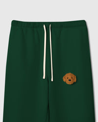 Close-up of curly plush poodle face on green 350gsm cotton sweatpant